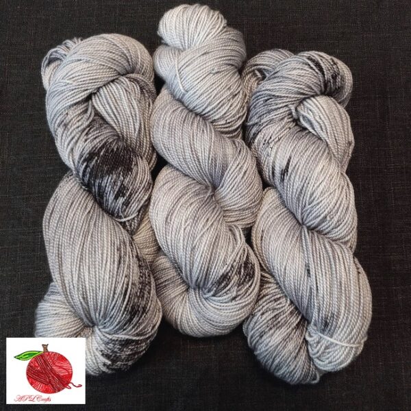 An almost tonal grey yarn that's hit with heavy black speckles and splotches.