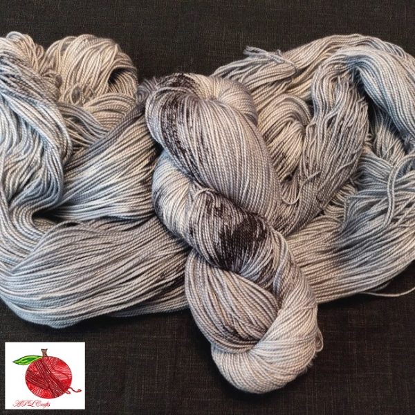 An almost tonal grey yarn that's hit with heavy black speckles and splotches
