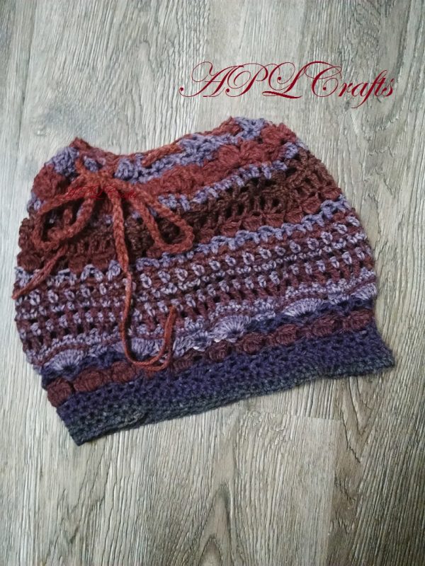 A Free form crocheted hat that has the feel of a slouchy hat, and can be worn like a slouchy hat, or a tube hat.