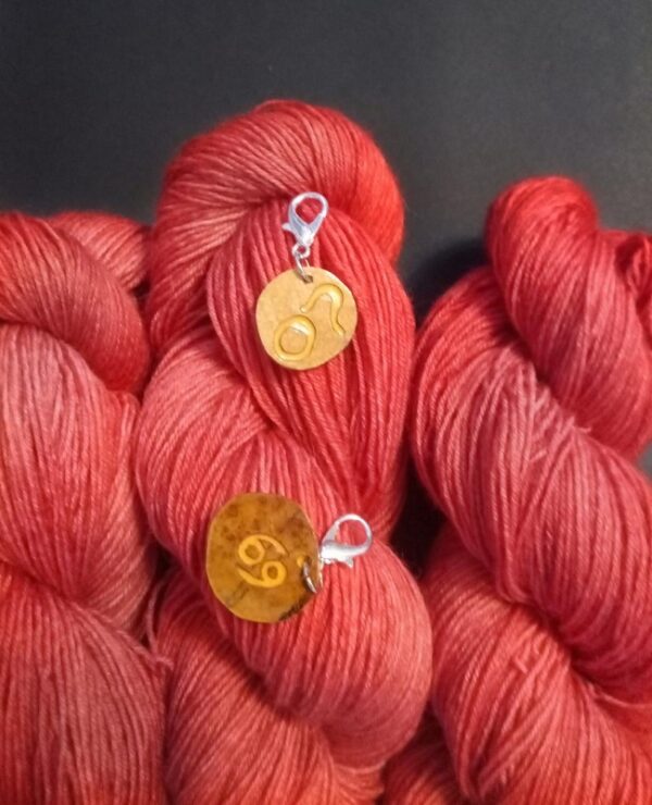 ruby red birthstone yarn color with zodiac charm/progress keepers