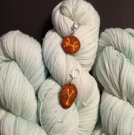 yarn in march birthstone color with zodiac charms