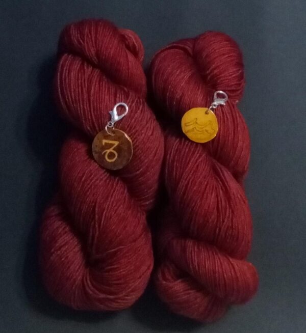 yarn in january birthstone color with zodiac charms