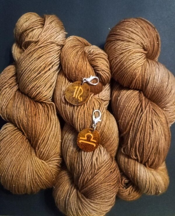yarn in november birthstone color with zodiac charms